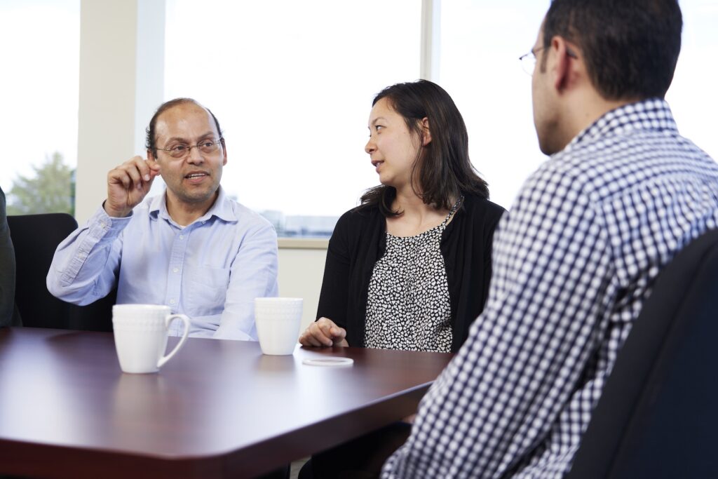 people chatting in boardroom